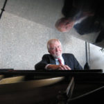 Jim Gibson at a grand piano