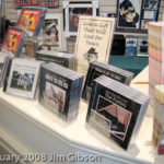 Photo of countertop display of Jim Gibson's solo piano CDs.