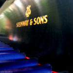 Steinway piano with interesting lighting on the keys and nameplate