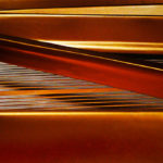 Photo of golden strings of a Steinway grand piano